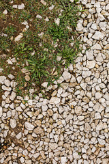 Stone rubble underfoot. Grunge background texture.