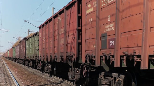 Freight train with cargo containers passing by