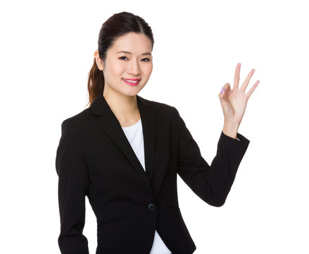 Businesswoman with ok sign gesture
