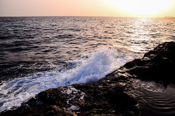 Strong Waves Crashing on the Volcanic Coast