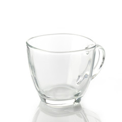 Tea cup made of transparent glass on white background shot in studio