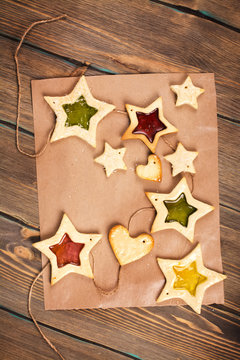 Homemade star shaped cookies. Tasty decorations for fir tree. Toned image