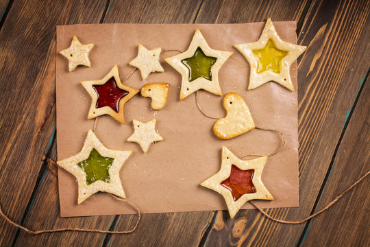 Homemade star shaped cookies. Tasty decorations for fir tree. Toned image