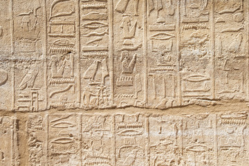 old egypt hieroglyphs carved on the stone