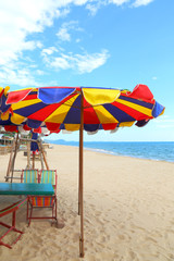 beach umbrella and beach under blue sky