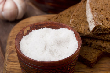 Fototapeta na wymiar Large food salt in wooden container
