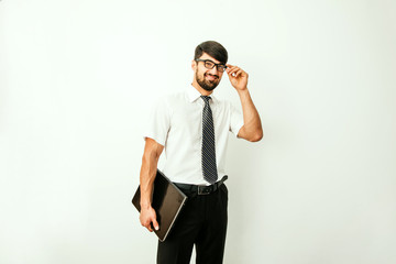 Portrait of an handsome businessman with a laptop