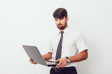 Portrait of an handsome businessman with a laptop