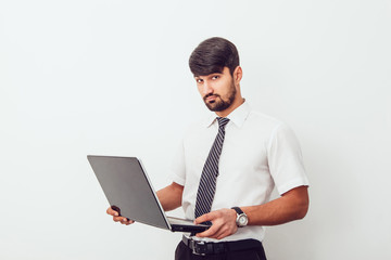 Portrait of an handsome businessman with a laptop