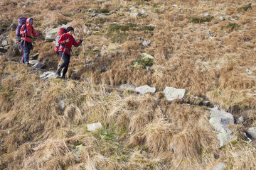 Two girls are traveling in the mountains.