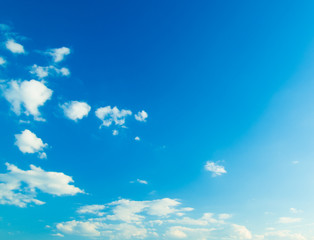 blue sky background with tiny clouds