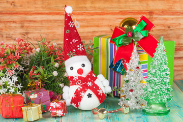 Cheerful Christmas snowman on  background.