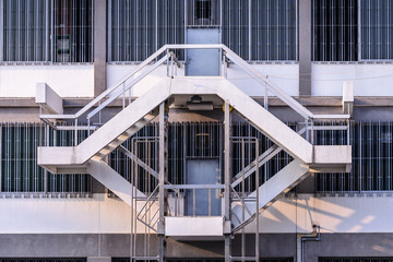 Staircase between floor of factory building.