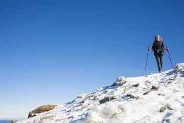 Fotobehang Climber is on the slope. © zhukovvvlad