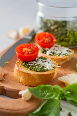Toasts with pesto sause and tomatoes