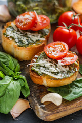Toasts with pesto sause and tomatoes
