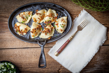 Dumplings with meat, onion and bacon.