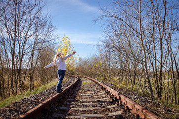 child walking on rail