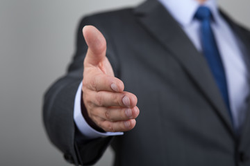 Businessman offering his hand for handshake