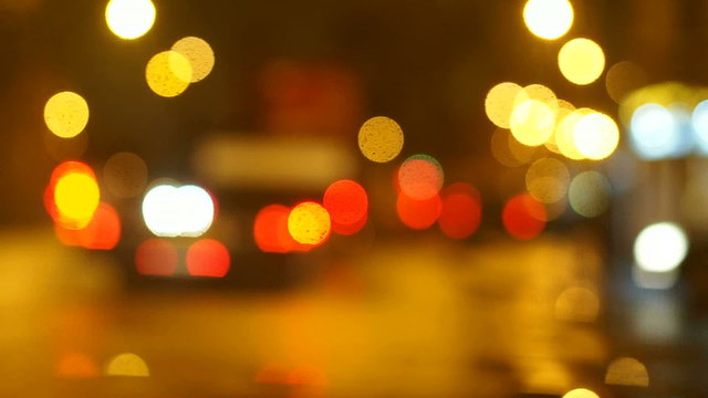 Lights of the city. City background. Lights of the big city. City night, cars on the road, headlights, night life, beautiful bokeh. Night city in refocuse. Street defocusing. Illumination of the city.