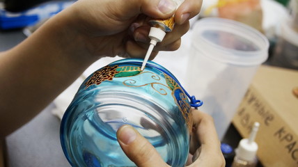 painting with  stained glass paints and line paints on transparent blue glass jar - 96152542