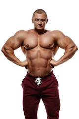 Fototapeta na wymiar bodybuilder posing. Handsome power athletic guy male. Fitness mu
