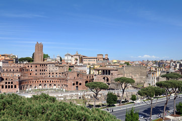 Fototapeta na wymiar The part of old town and Roman ruins in Rome
