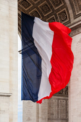 National flag of France with detail of triumphal arch, Paris, Fr