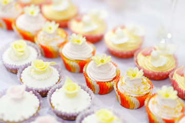 Decorated cupcakes on a white table