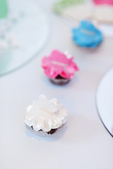 Decorated cupcakes on a white table