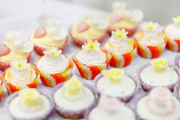 Decorated cupcakes on a white table