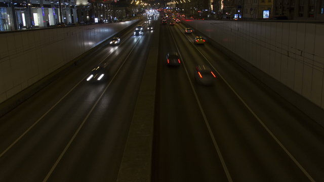 Lights of night city. Cars and road timelapse