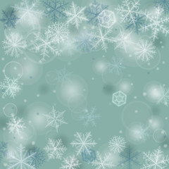 Fototapeta na wymiar Abstract winter background with various snowflakes.