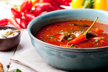 Goulash, beef, tomato, pepper, chili, smoked paprika soup. 