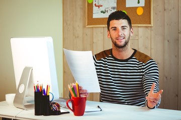 Handsome hipster working at desk