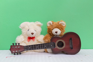 Two teddy with guitar. Concept about love and relationship