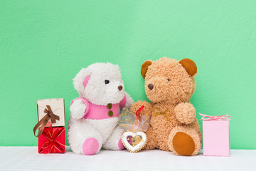 Two teddy with gift. Concept about love and relationship.