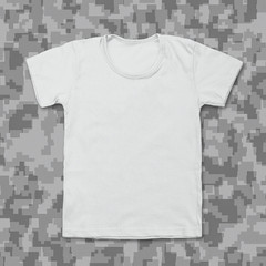 White blank t-shirt on camouflage background