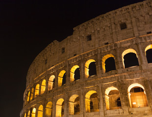 Fototapeta na wymiar Colosseum (Coliseum) at night in Rome, Italy