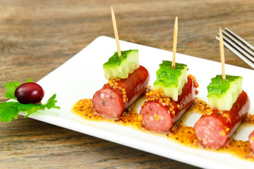 Cocktail Sausage and Cucumber on Plate.
