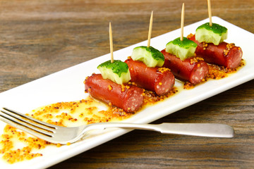 Cocktail Sausage and Cucumber on Plate.