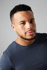 Fototapeta premium Studio Portrait Of Man Standing Against Grey Background