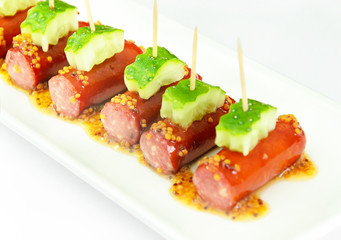 Cocktail Sausage and Cucumber on Plate.