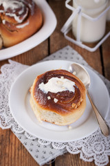 Homemade glazed cinnabons with cinnamon and almonds, american kitchen. .