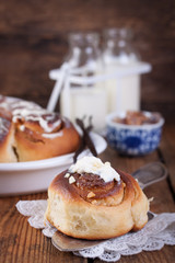Homemade glazed cinnabons with cinnamon and almonds, american kitchen