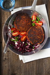 cutlets from legumes. with salad in a frying pan. for background
