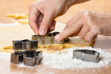 hands making christmas cookies