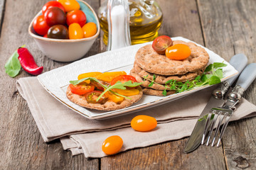Tomato and arugula sandwiches with ingredients