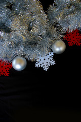 Christmas decoration composition tinsel baubles and snowflakes