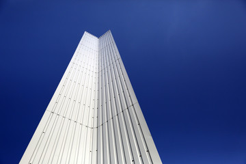 Fototapeta na wymiar Architectural Detail of steel metal a modern geometry with blue sky background with copy space